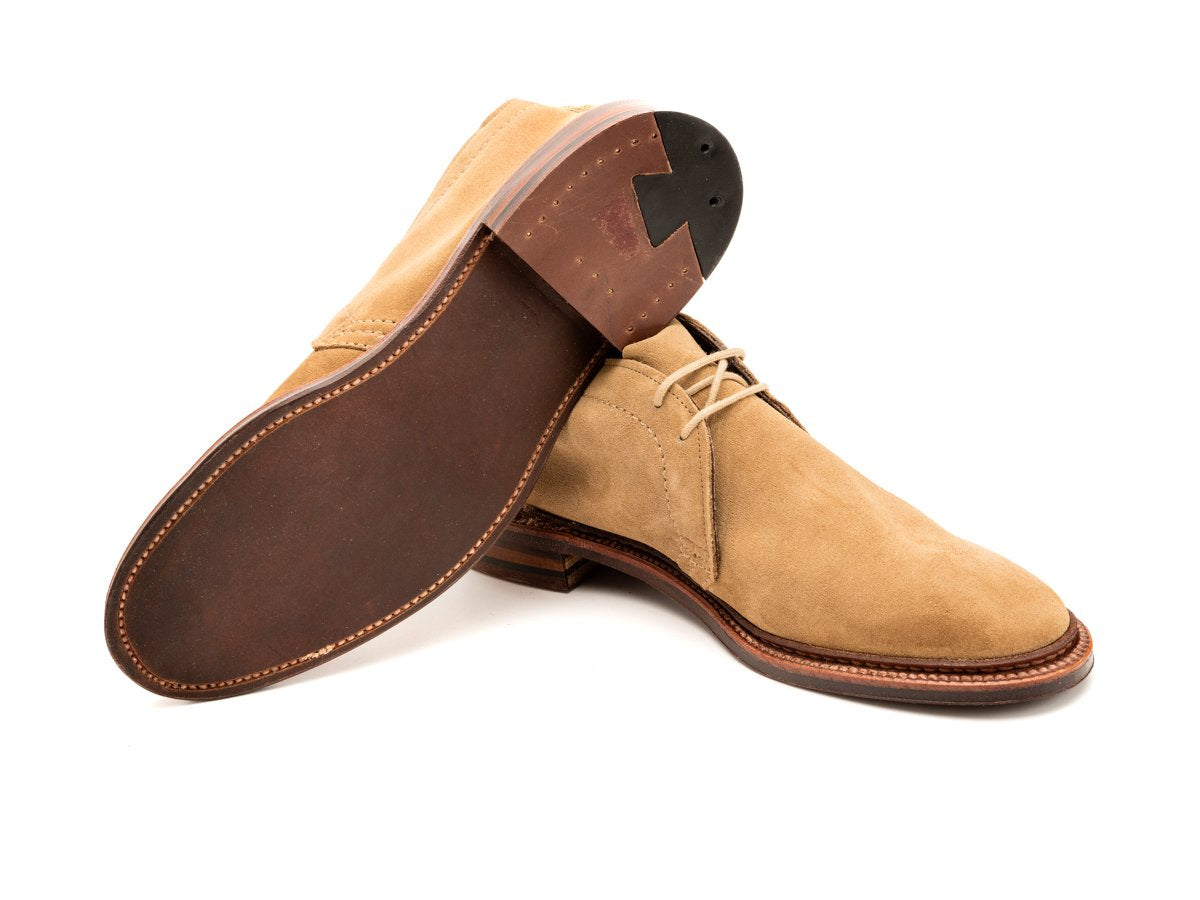 Leather sole of E width Alden unlined chukka boot in tan suede