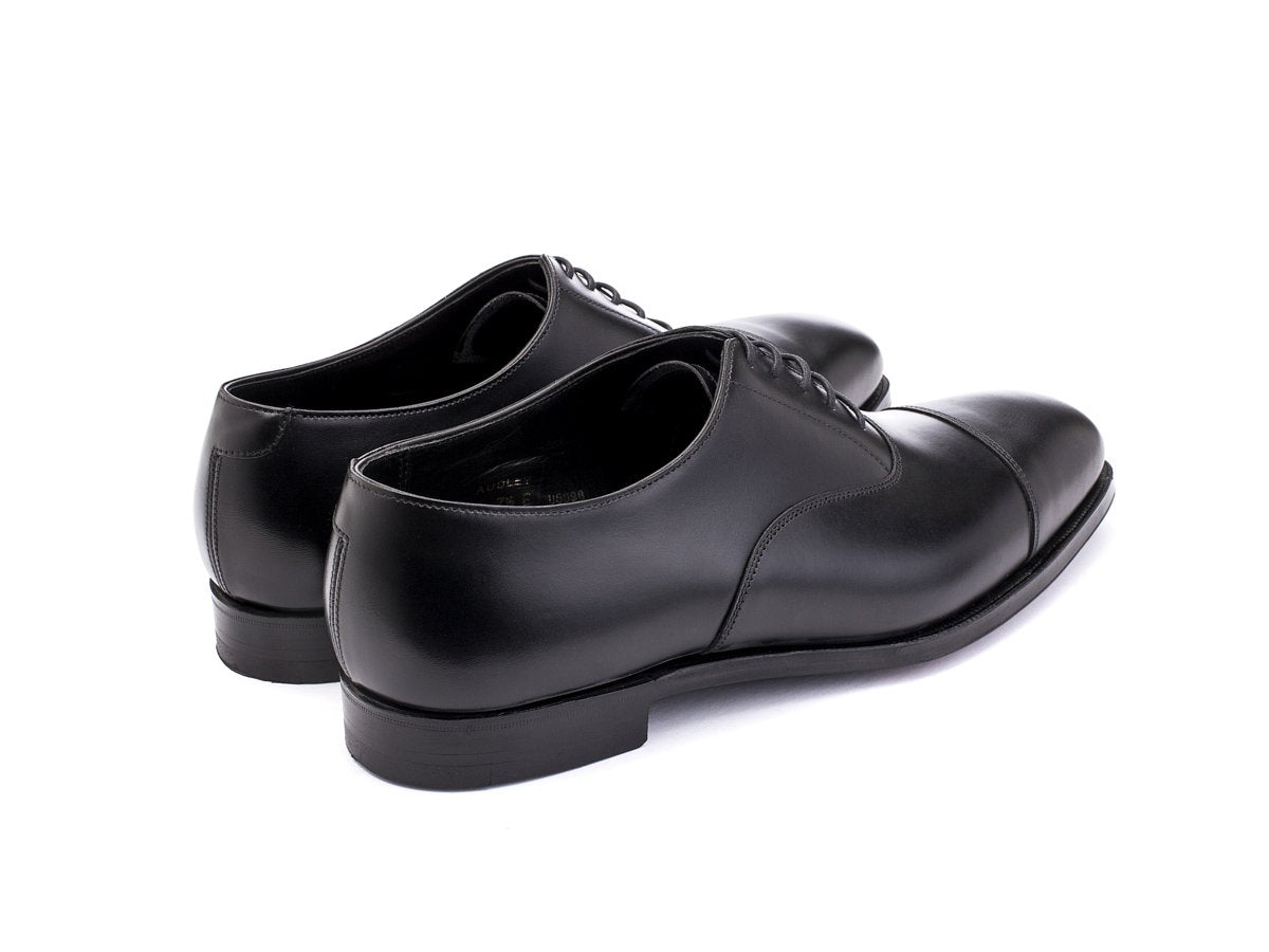 Back angle view of Crockett & Jones Audley plain captoe oxford shoes in black calf