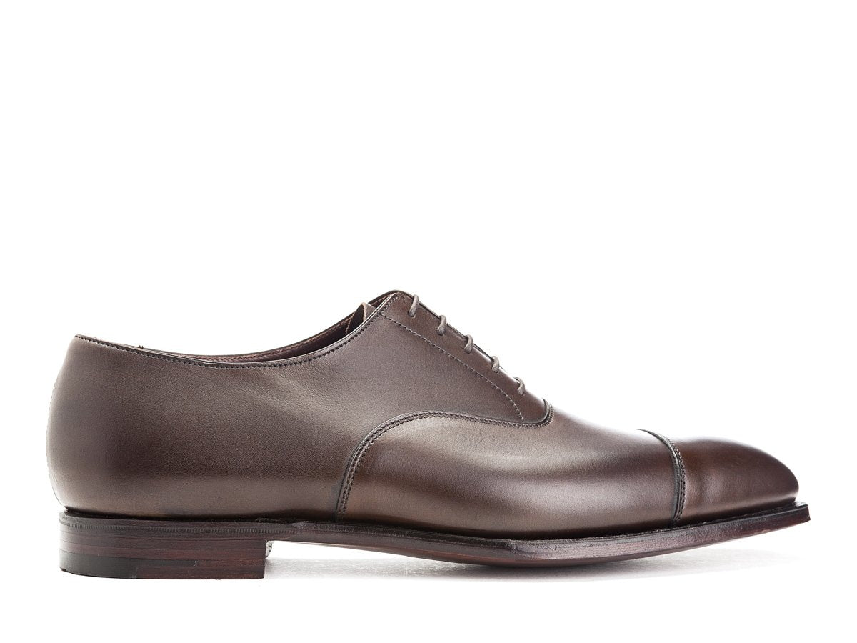 Side view of Crockett & Jones Audley plain captoe oxford shoes in dark brown antique calf