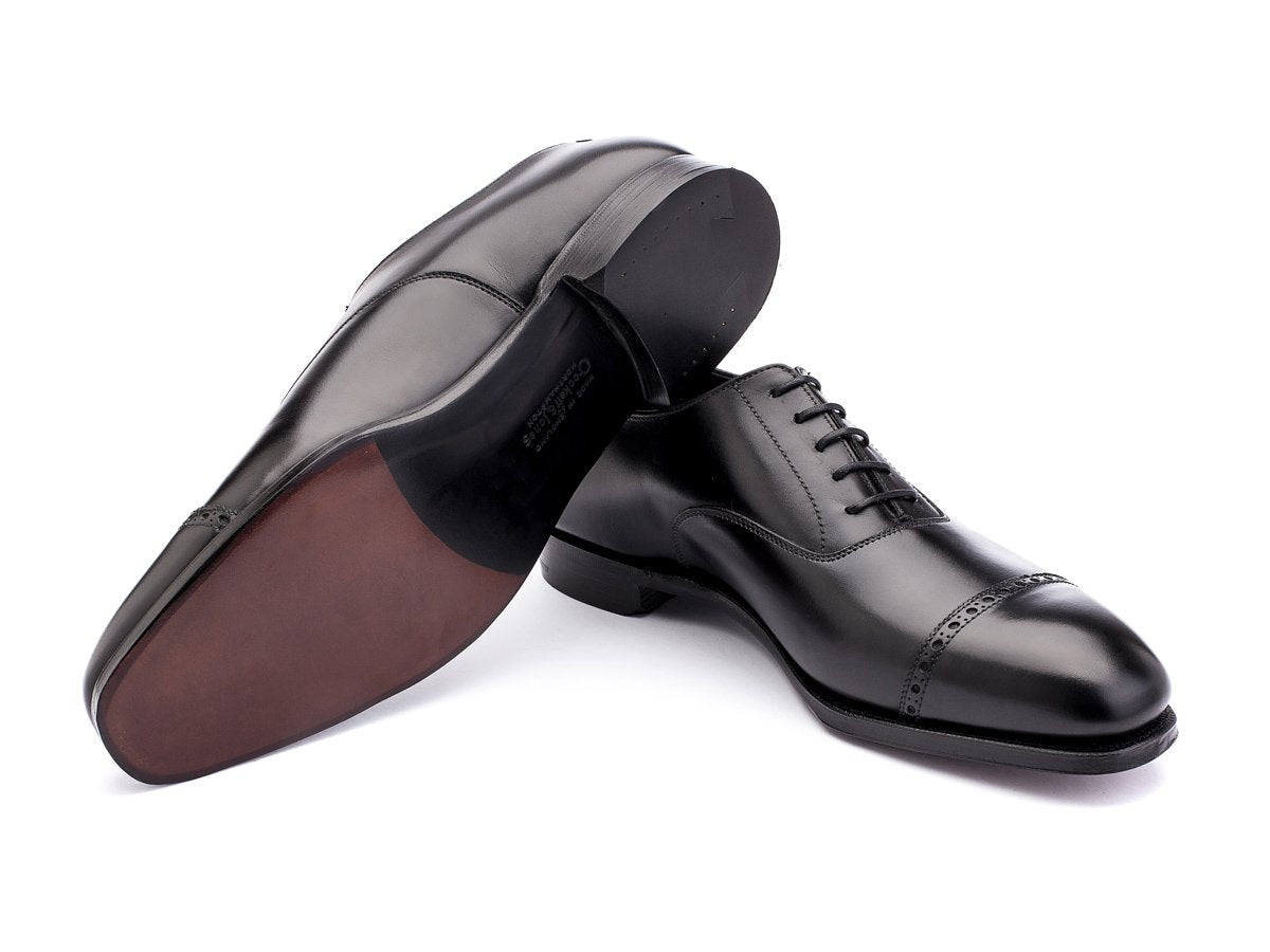 Leather sole of Crockett & Jones Belgrave quarter brogue oxford shoes in black calf