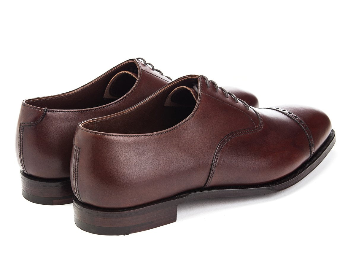 Back angle view of Crockett & Jones Belgrave quarter brogue oxford shoes in chestnut antique calf