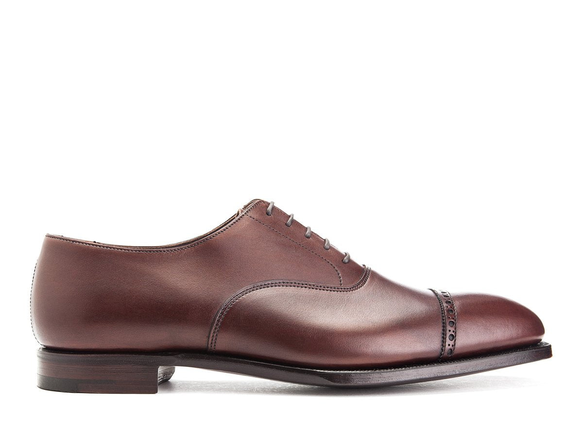 Side view of Crockett & Jones Belgrave quarter brogue oxford shoes in chestnut antique calf