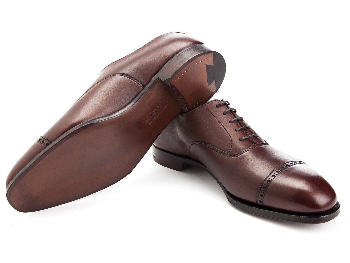Leather sole of Crockett & Jones Belgrave quarter brogue oxford shoes in chestnut antique calf