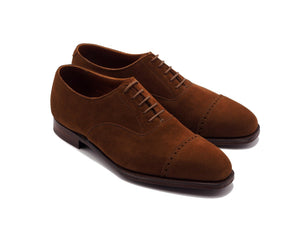 Front angle view of Crockett & Jones Belgrave quarter brogue oxford shoes in polo brown suede