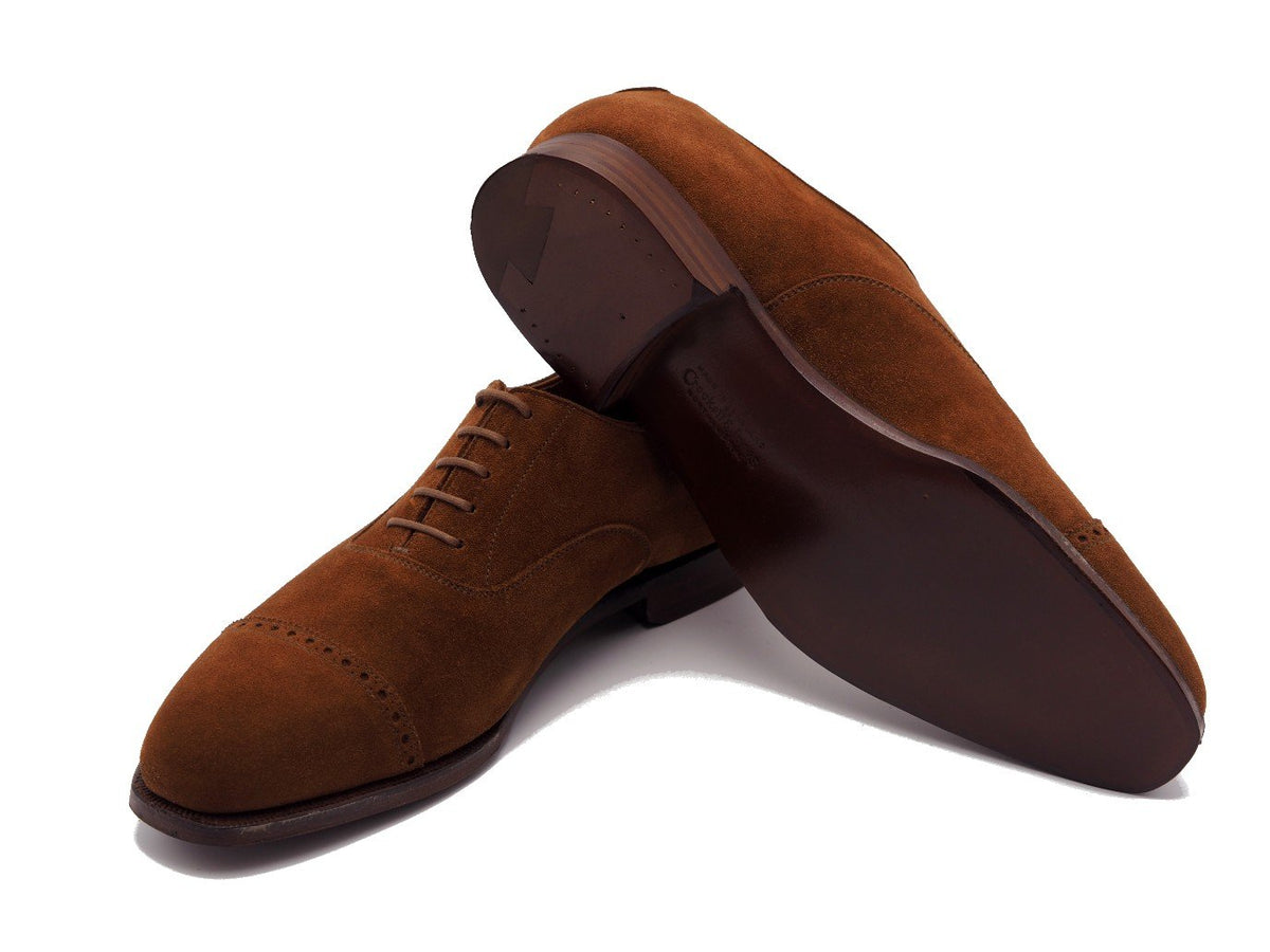 Leather sole of Crockett & Jones Belgrave quarter brogue oxford shoes in polo brown suede