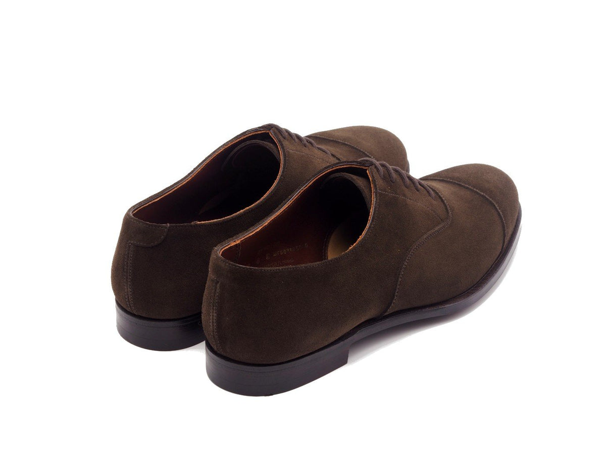 Back angle view of Crockett & Jones Bendigo plain captoe oxford shoes in dark brown suede