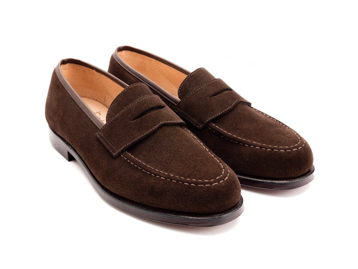 Front angle view of Crockett & Jones Boston penny loafers in dark brown suede