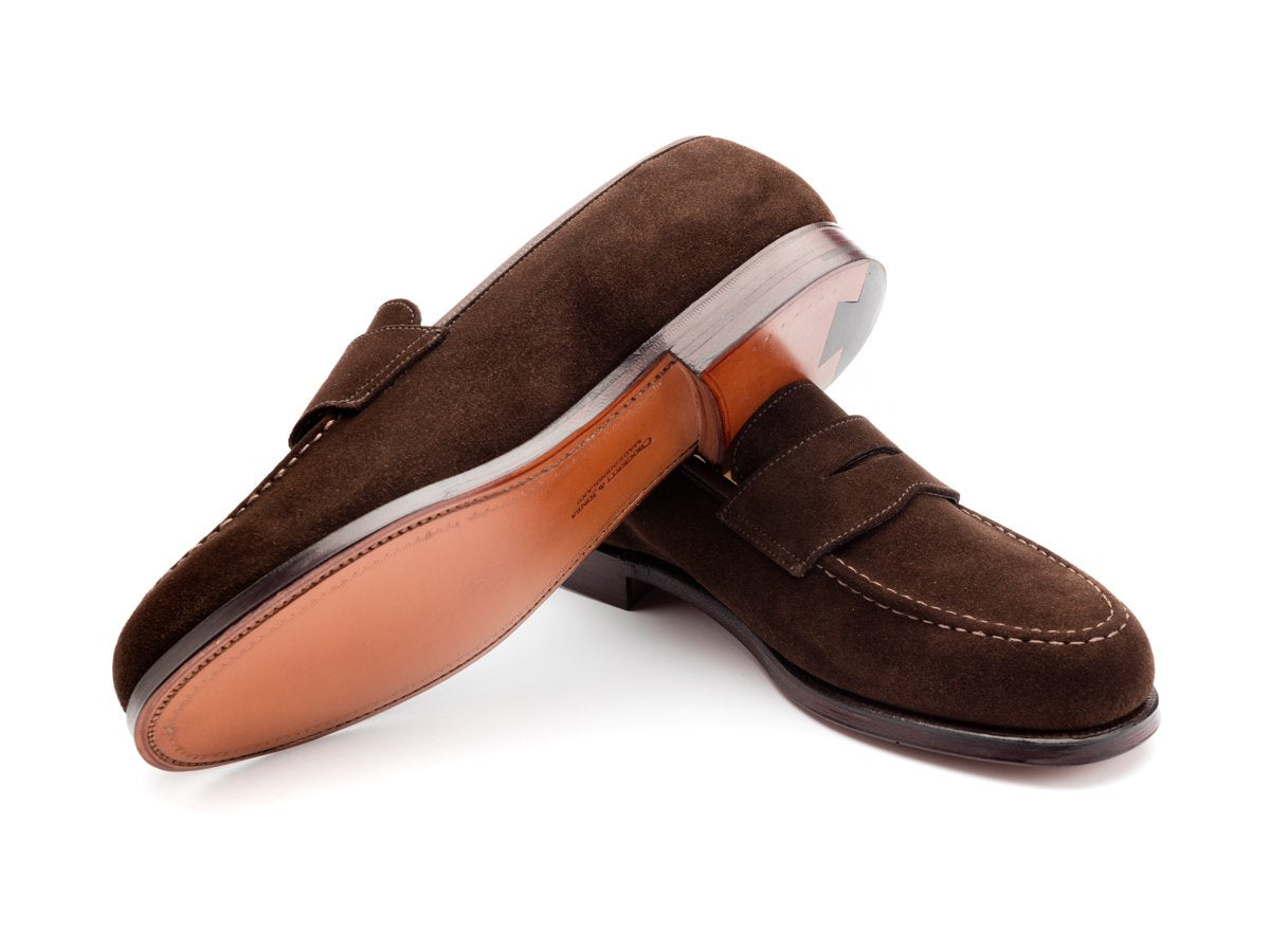 Leather sole of Crockett & Jones Boston penny loafers in dark brown suede