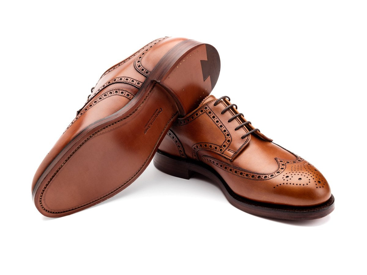 Leather sole of Crockett & Jones Cardiff wingtip full brogue derby shoes in tan burnished calf