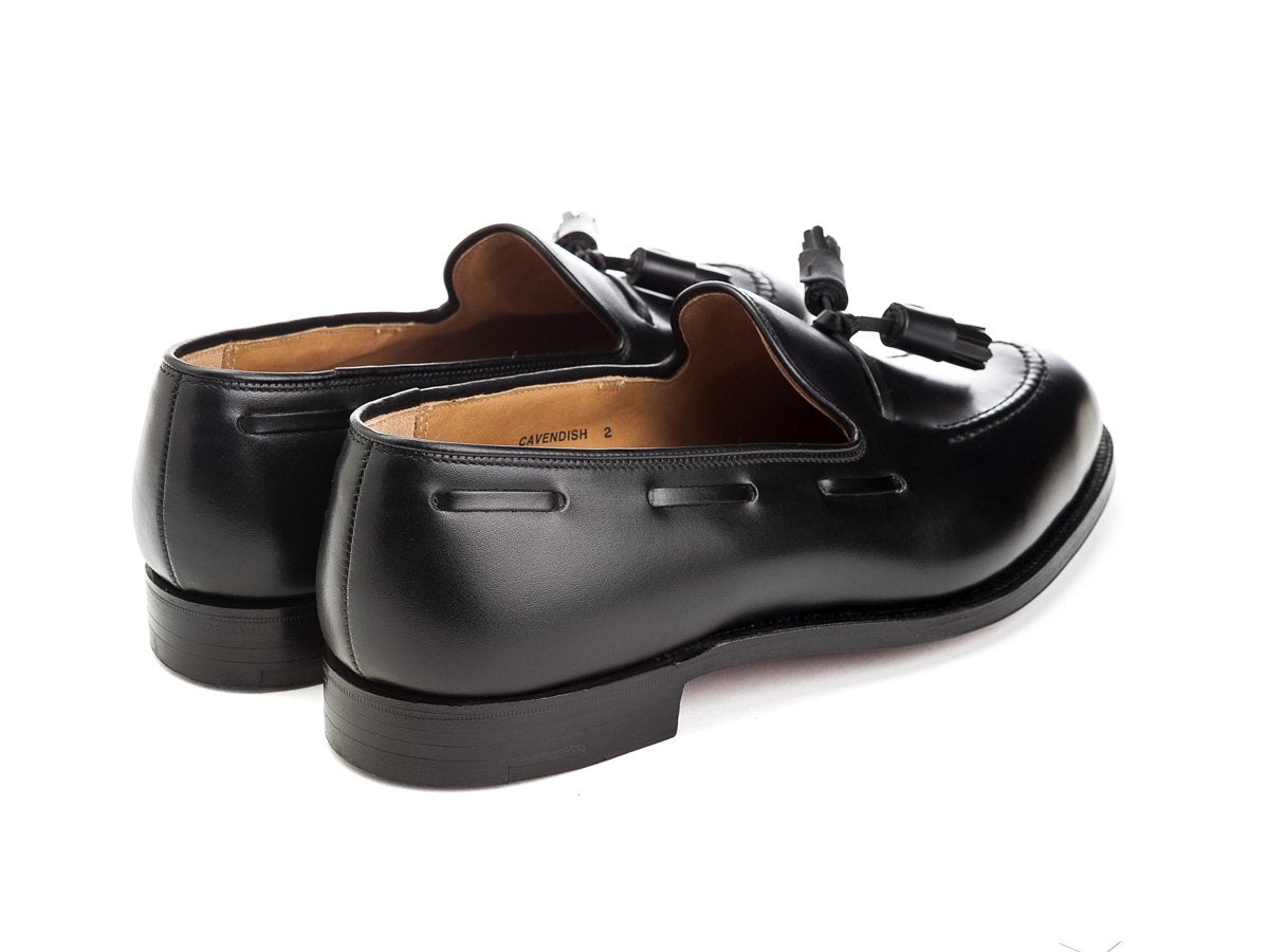 Back angle view of Crockett & Jones Cavendish tassel loafers in black calf