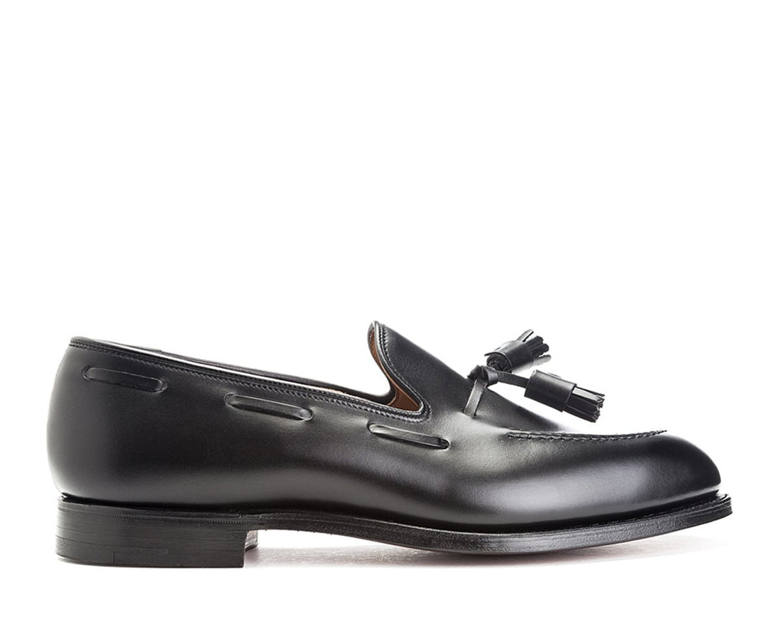 Side view of Crockett & Jones Cavendish tassel loafers in black calf