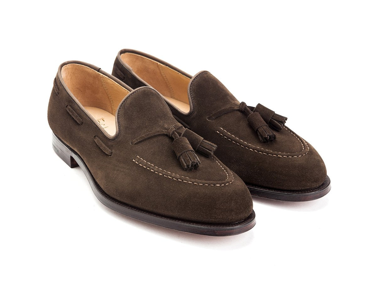 Front angle view of Crockett & Jones Cavendish tassel loafers in dark brown suede