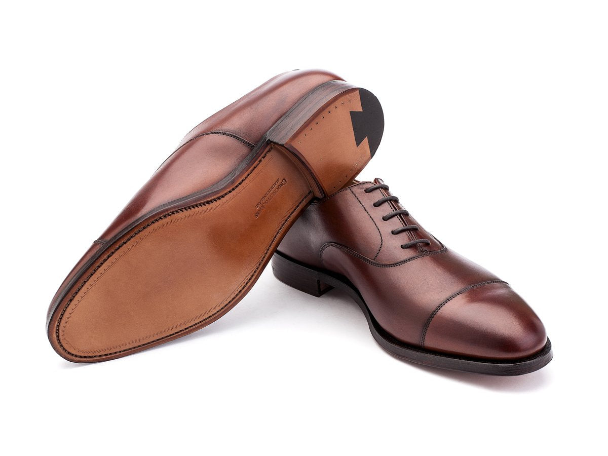 Leather sole of F width Crockett & Jones Connaught plain captoe oxford shoes in chestnut burnished calf