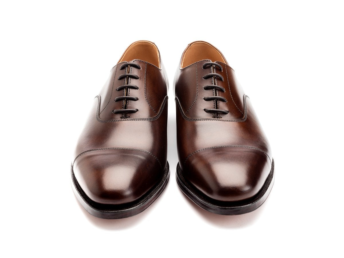 Front view of Crockett & Jones Connaught plain captoe oxford shoes in dark brown burnished calf