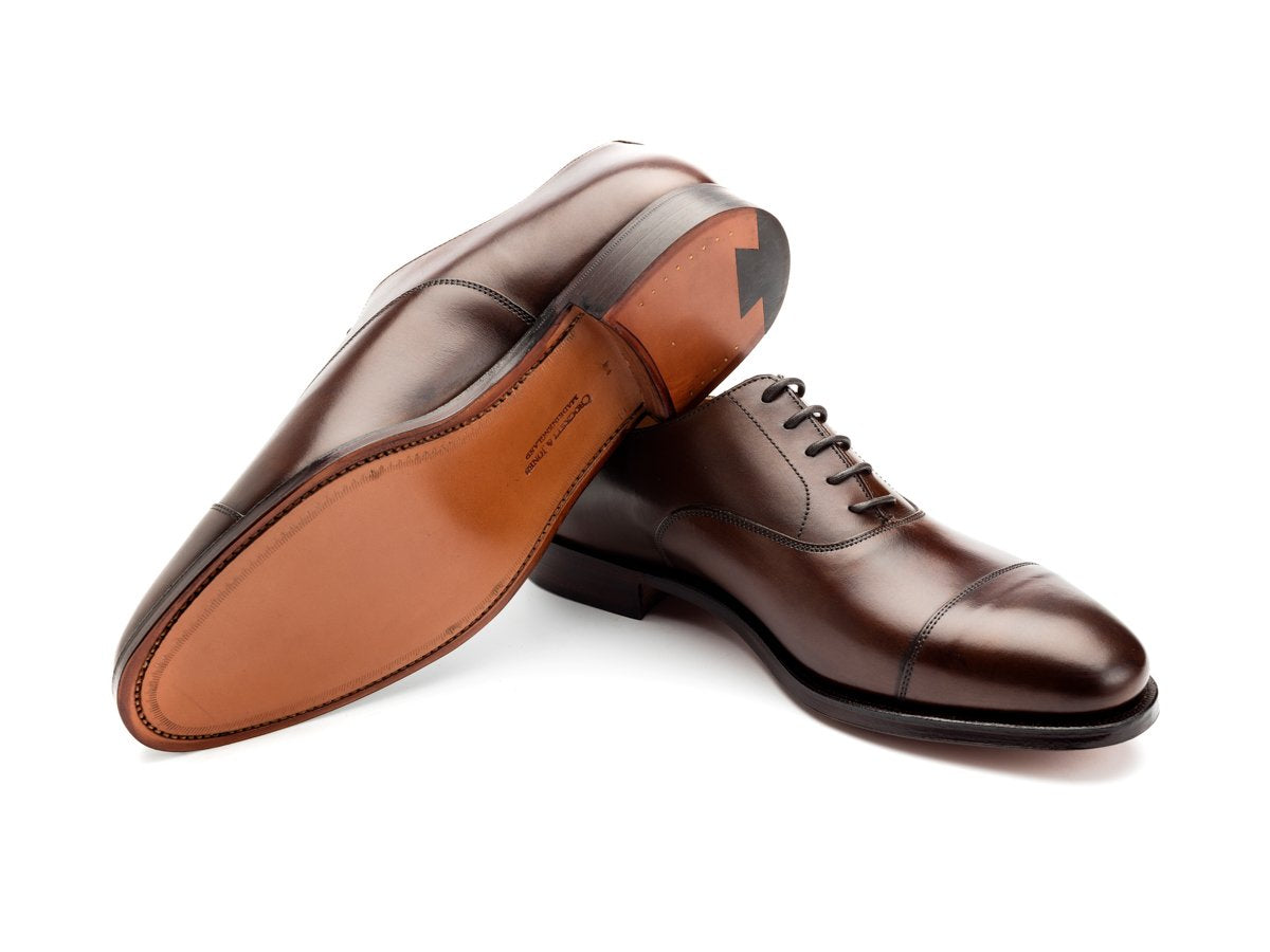 Leather sole of Crockett & Jones Connaught plain captoe oxford shoes in dark brown burnished calf