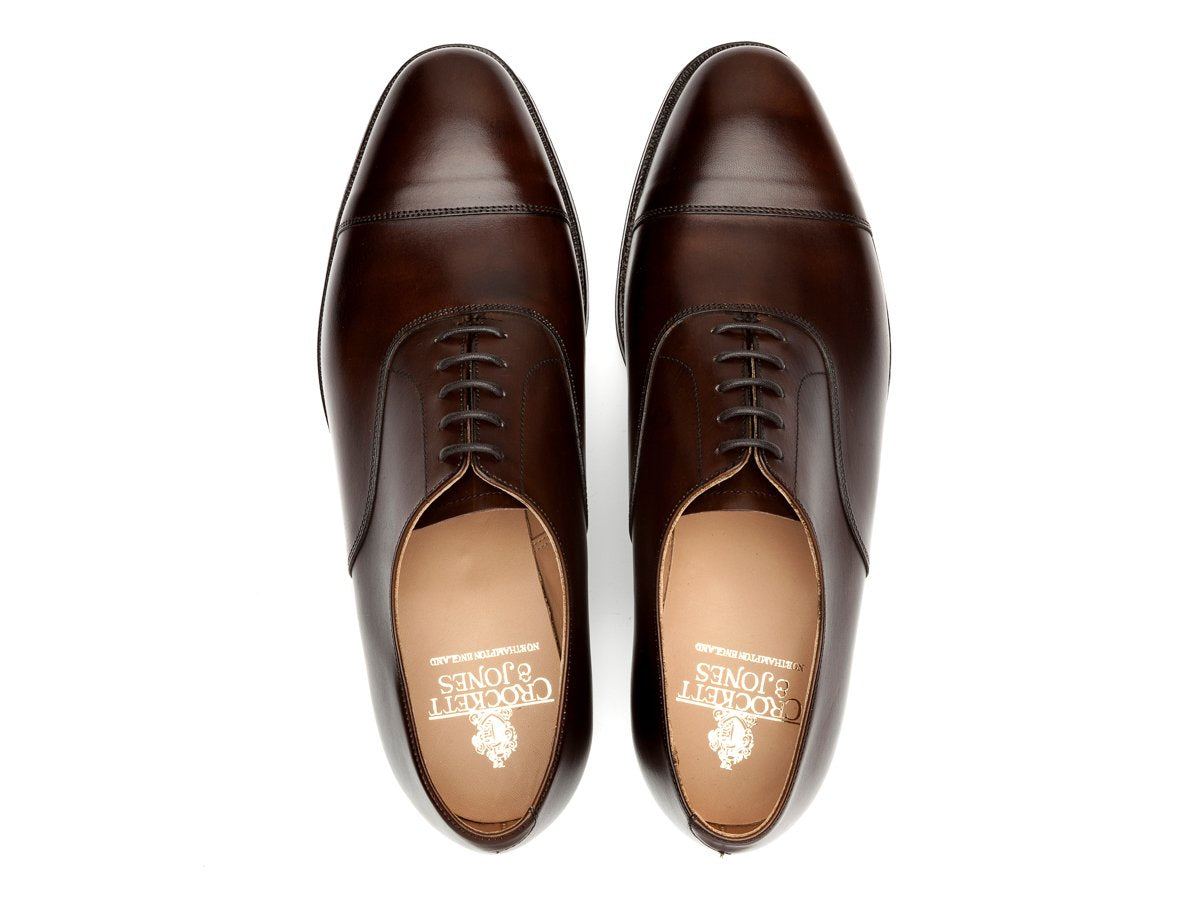 Top view of Crockett & Jones Connaught plain captoe oxford shoes in dark brown burnished calf
