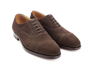 Front angle view of Crockett & Jones Connaught plain captoe oxford shoes in dark brown suede