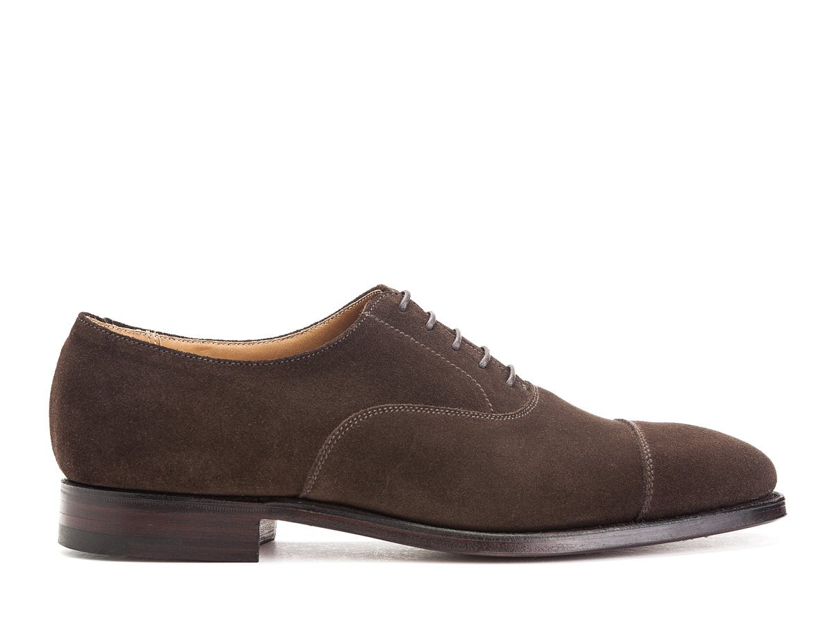 Side view of Crockett & Jones Connaught plain captoe oxford shoes in dark brown suede