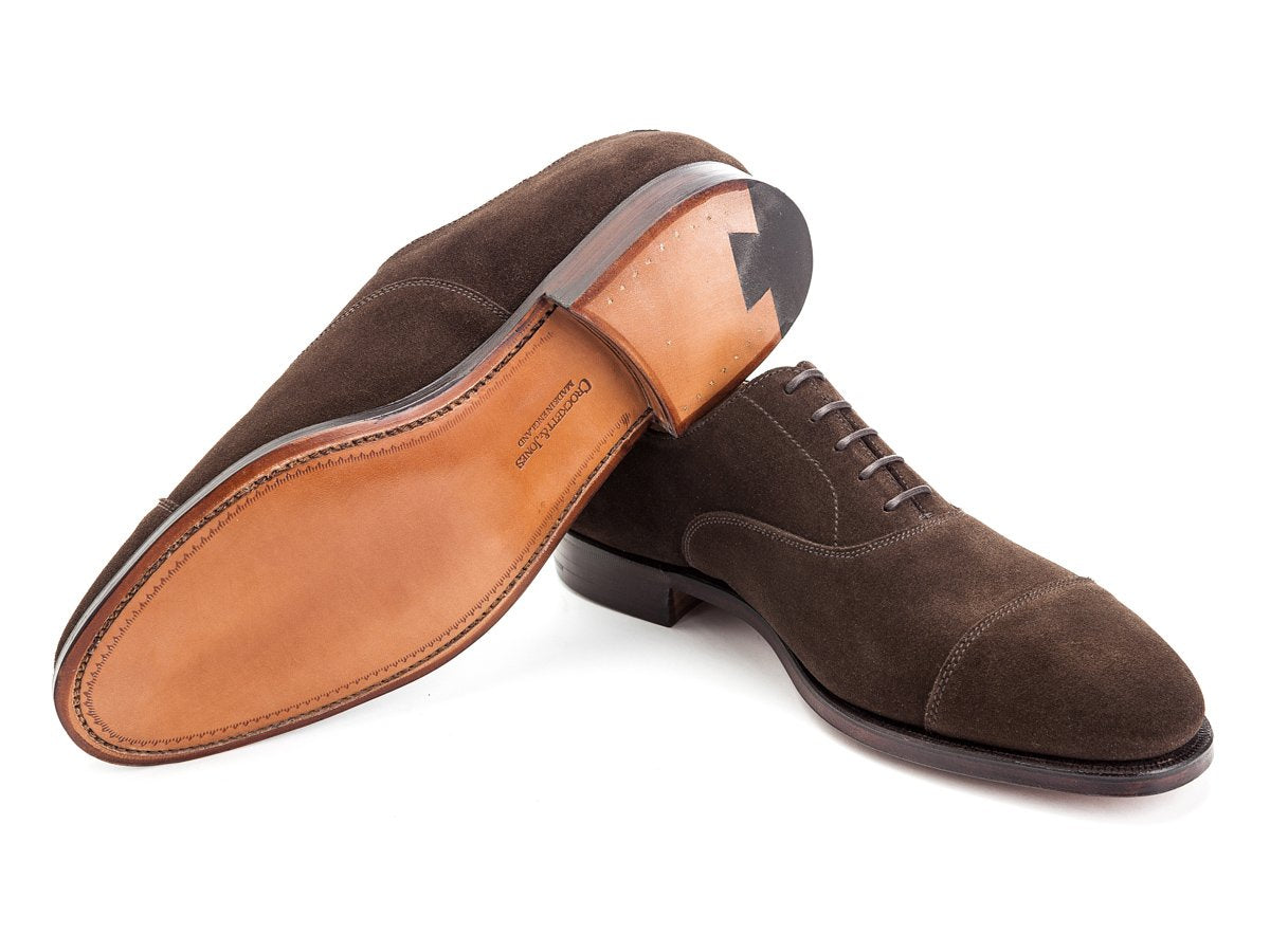 Leather sole of Crockett & Jones Connaught plain captoe oxford shoes in dark brown suede