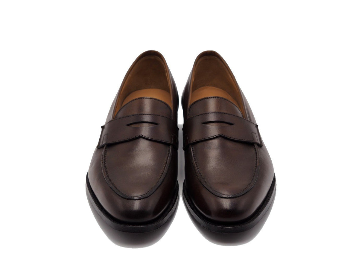 Front view of Crockett & Jones Crawford penny loafers in dark brown antique calf