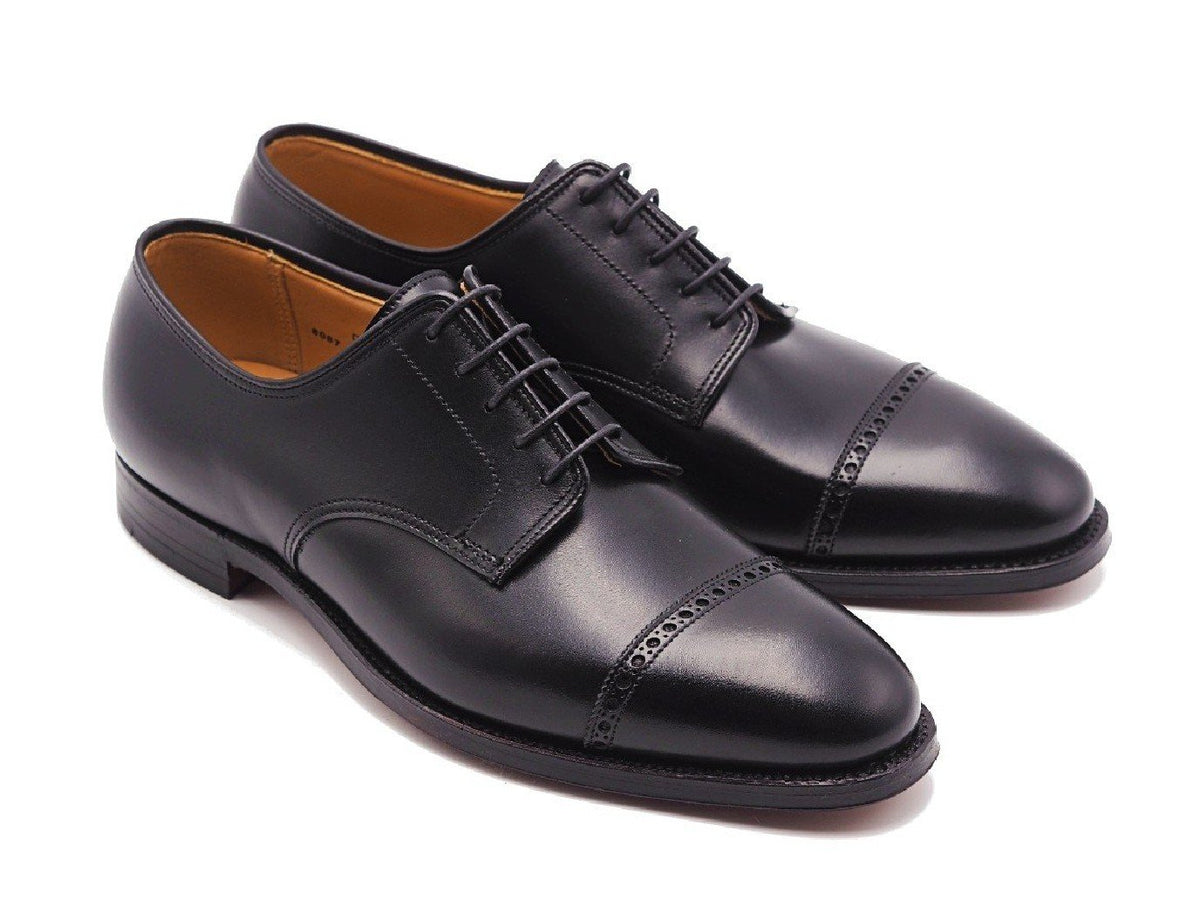 Front angle view of Crockett & Jones Draycott 2 quarter brogue derby shoes in black calf