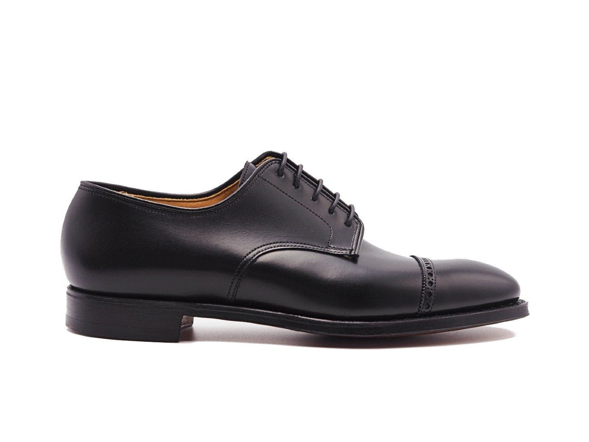 Side view of Crockett & Jones Draycott 2 quarter brogue derby shoes in black calf