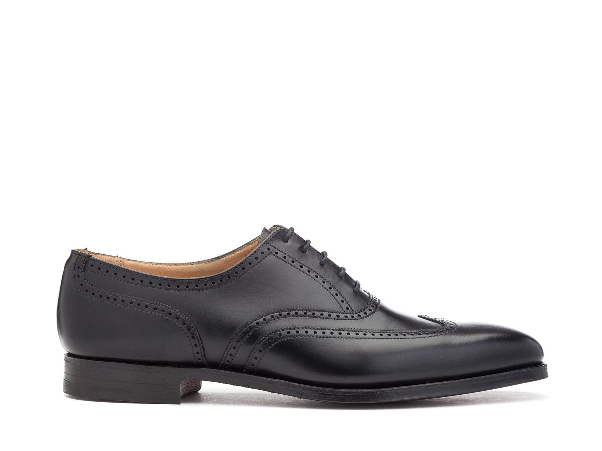 Side view of Crockett & Jones Drummond wingtip brogue oxford shoes in black calf