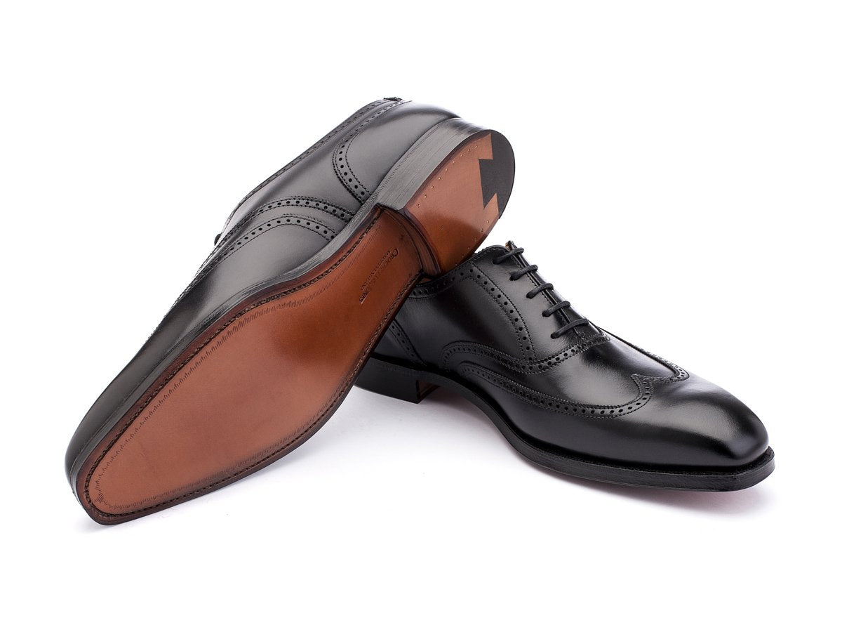 Leather sole of Crockett & Jones Drummond wingtip brogue oxford shoes in black calf