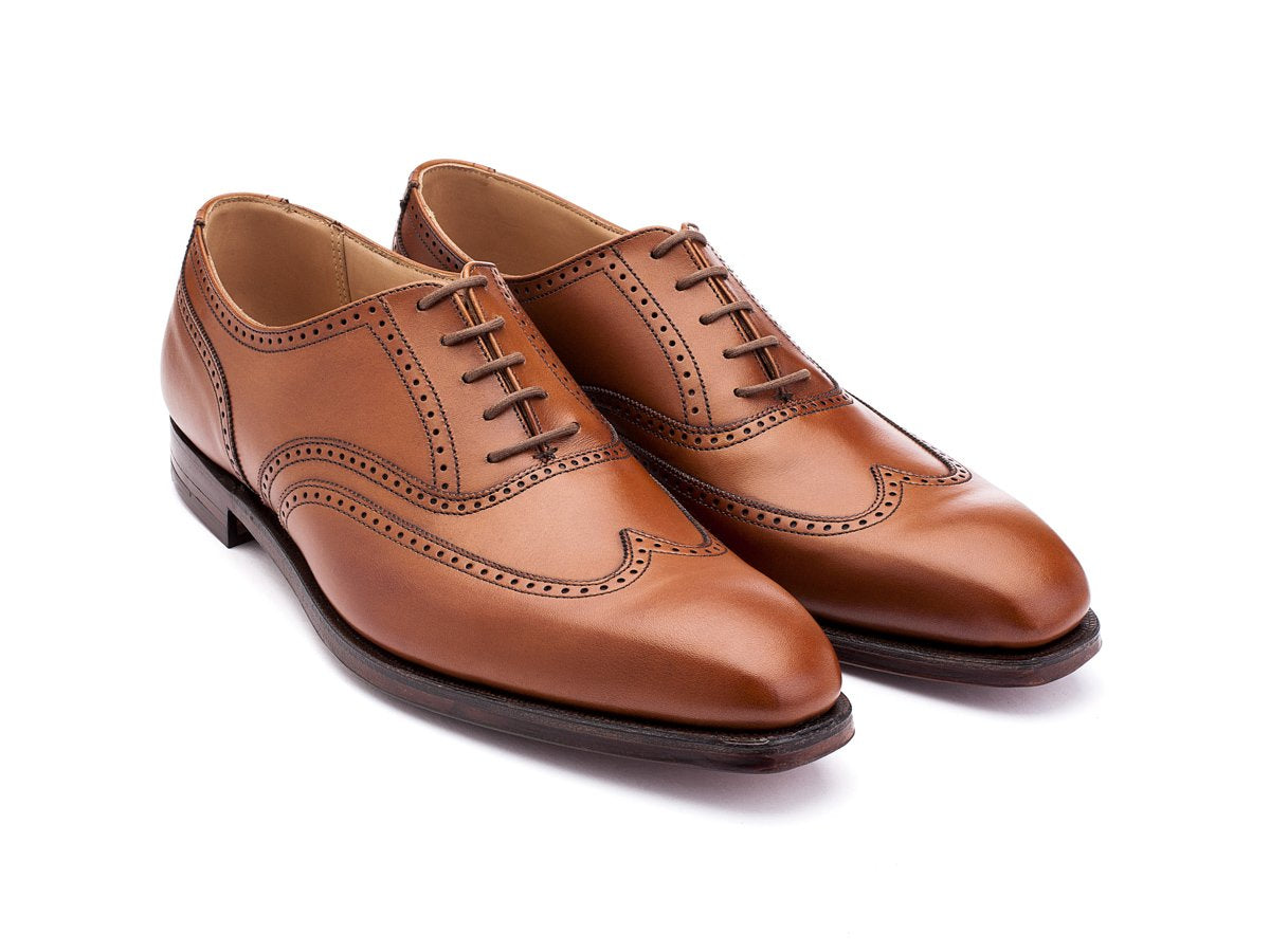 Front angle view of Crockett & Jones Drummond wingtip brogue oxford shoes in tan burnished calf