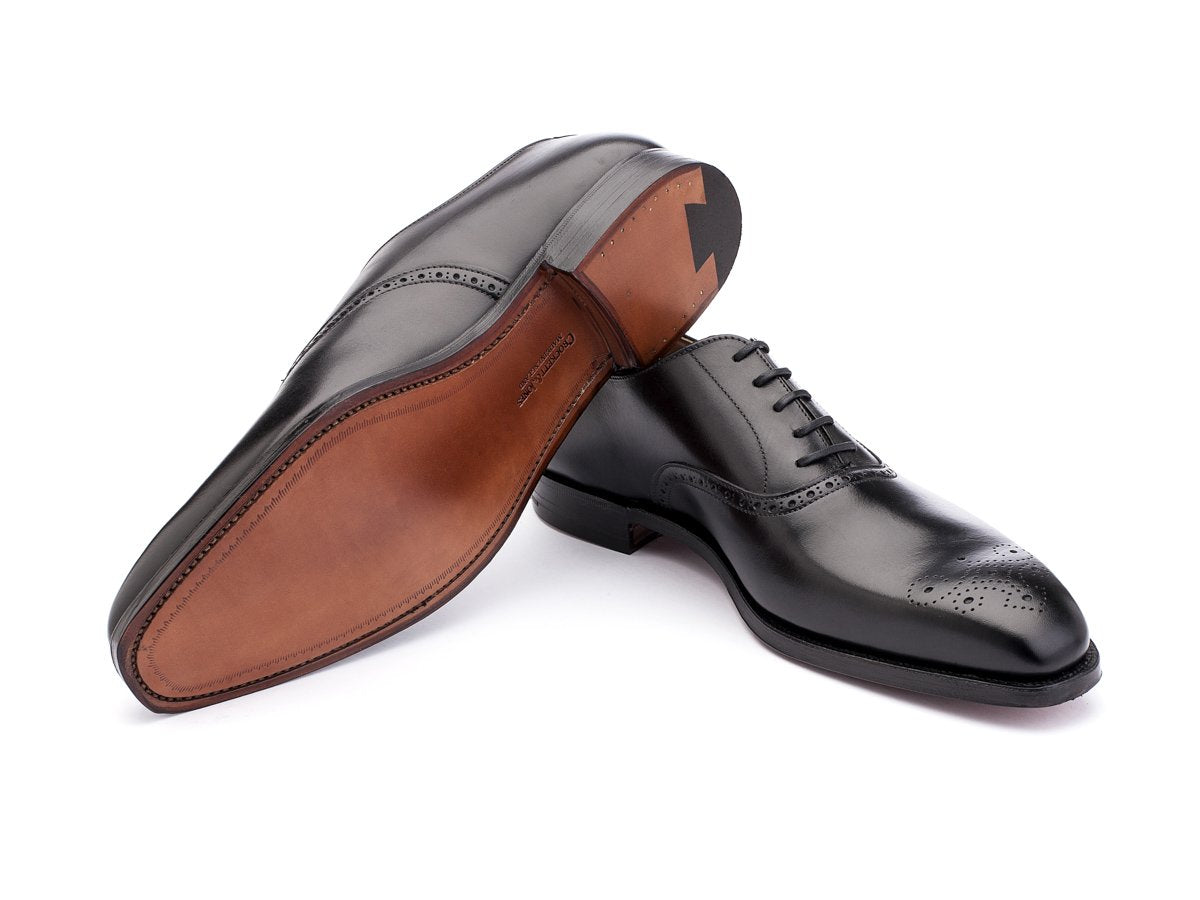 Leather sole of Crockett & Jones Edgware medallion brogue oxford shoes in black calf