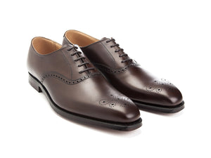 Front angle view of Crockett & Jones Edgware medallion brogue oxford shoes in dark brown burnished calf