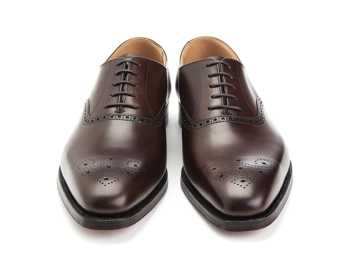 Front view of Crockett & Jones Edgware medallion brogue oxford shoes in dark brown burnished calf