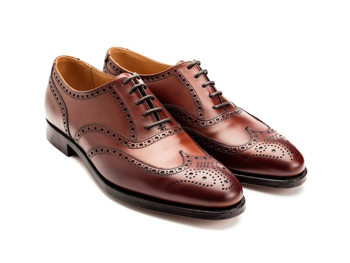 Front angle view of Crockett & Jones Finsbury wingtip full brogue oxford shoes in chestnut burnished calf