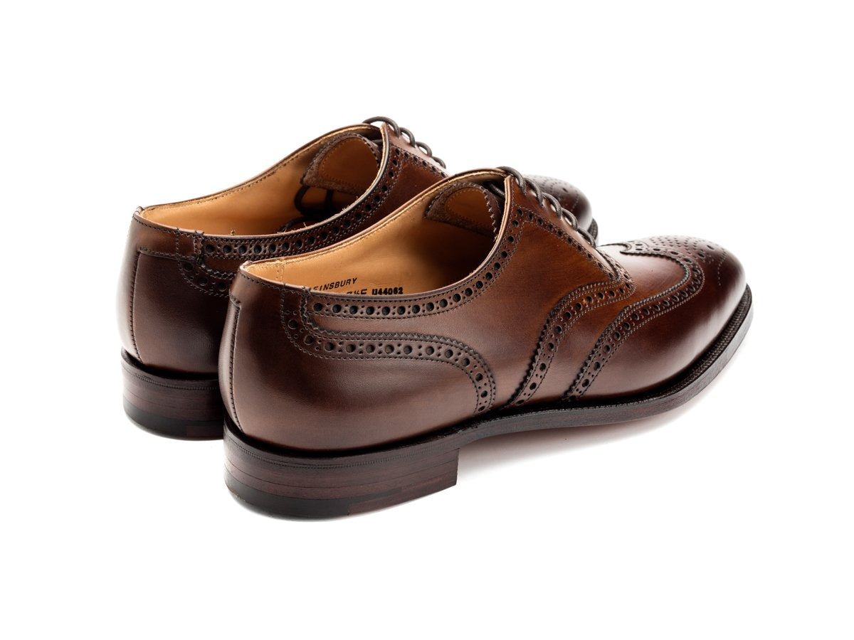 Back angle view of Crockett & Jones Finsbury wingtip full brogue oxford shoes in dark brown burnished calf