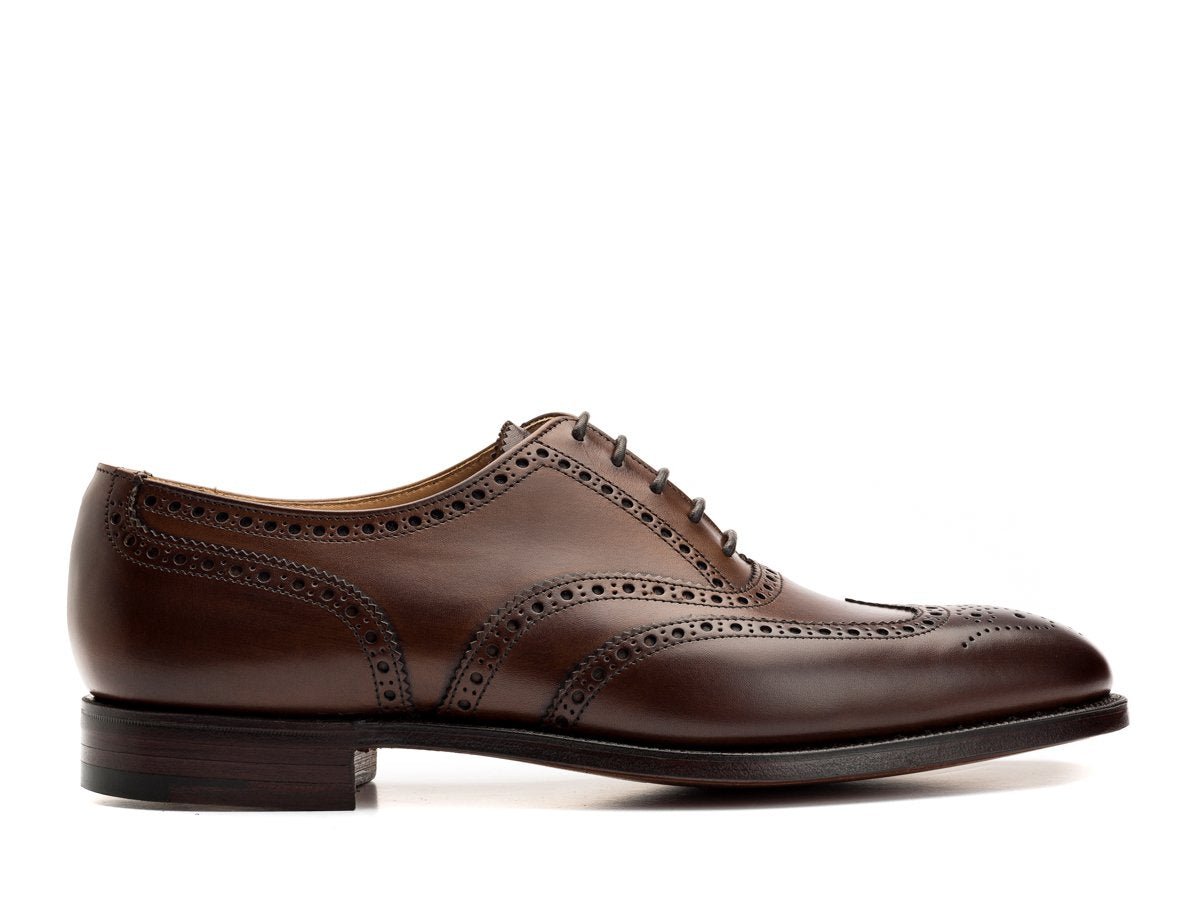 Side view of Crockett & Jones Finsbury wingtip full brogue oxford shoes in dark brown burnished calf
