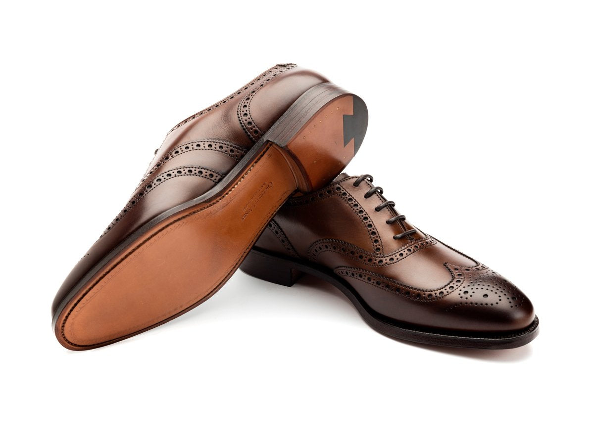 Leather sole of Crockett & Jones Finsbury wingtip full brogue oxford shoes in dark brown burnished calf