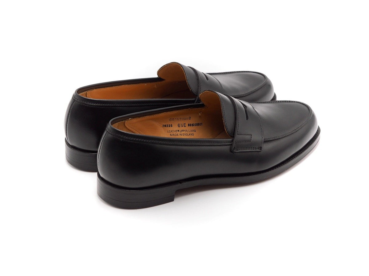 Back angle view of Crockett & Jones Grantham 2 penny loafers in black calf
