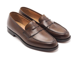 Front angle view of Crockett & Jones Grantham 2 penny loafers in dark brown burnished calf