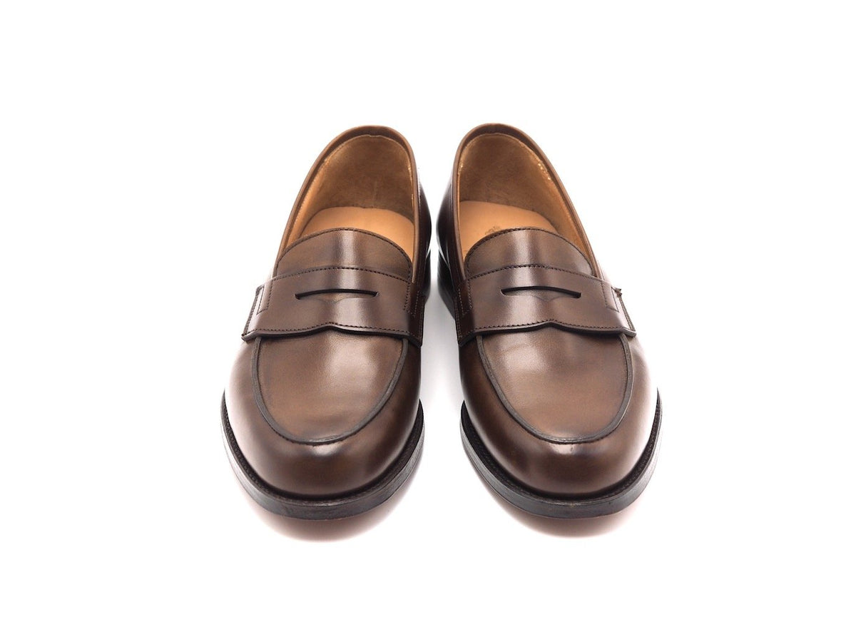 Front view of Crockett & Jones Grantham 2 penny loafers in dark brown burnished calf