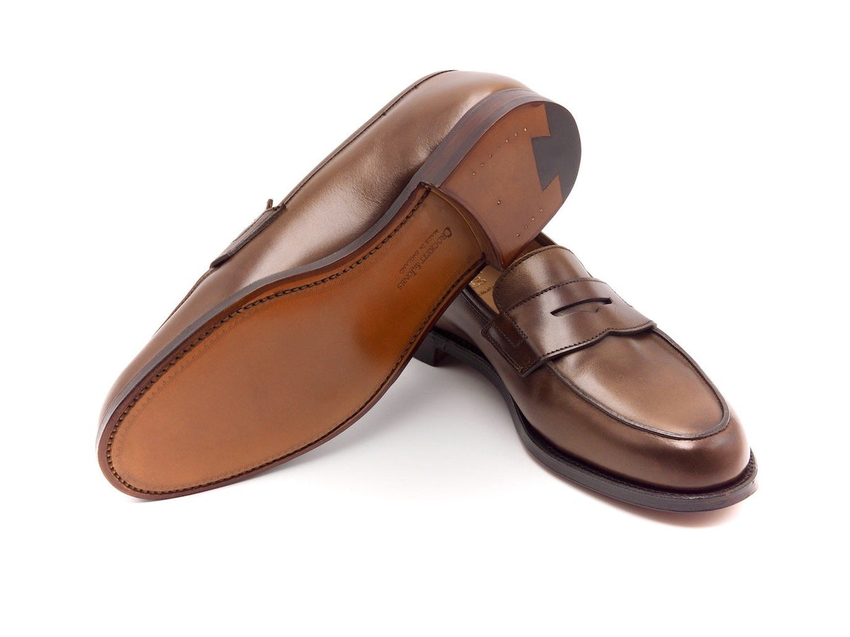 Leather sole of Crockett & Jones Grantham 2 penny loafers in dark brown burnished calf