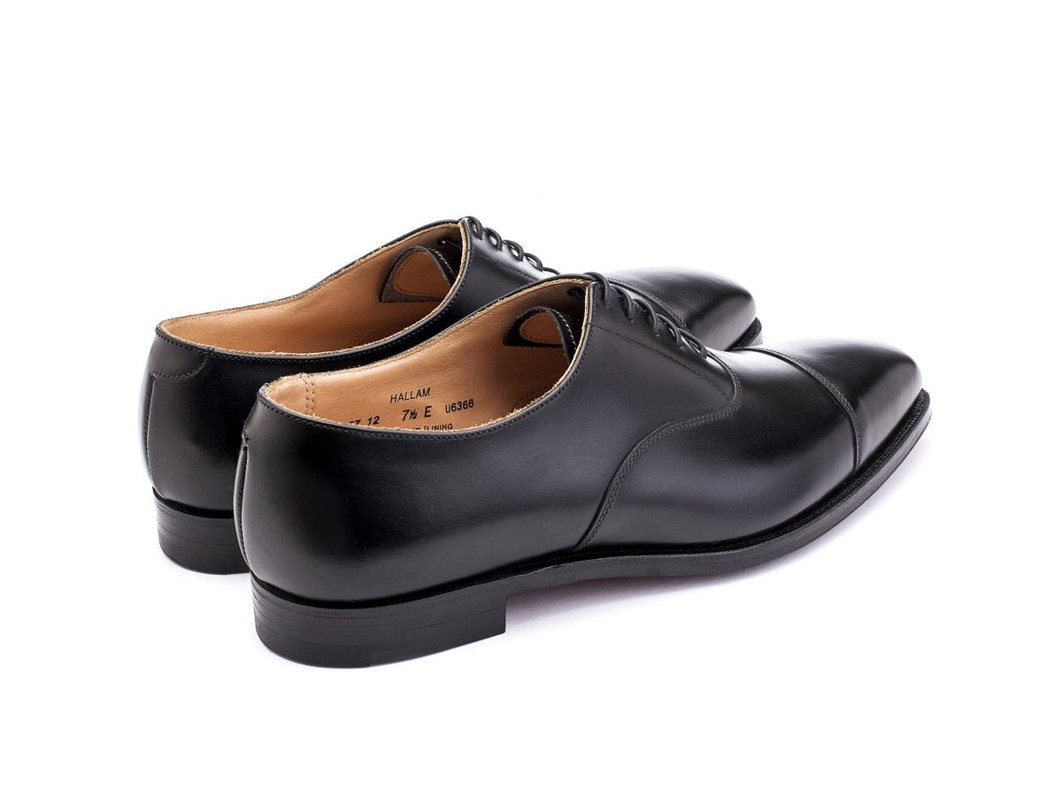 Back angle view of Crockett & Jones Hallam plain captoe oxford shoes in black calf