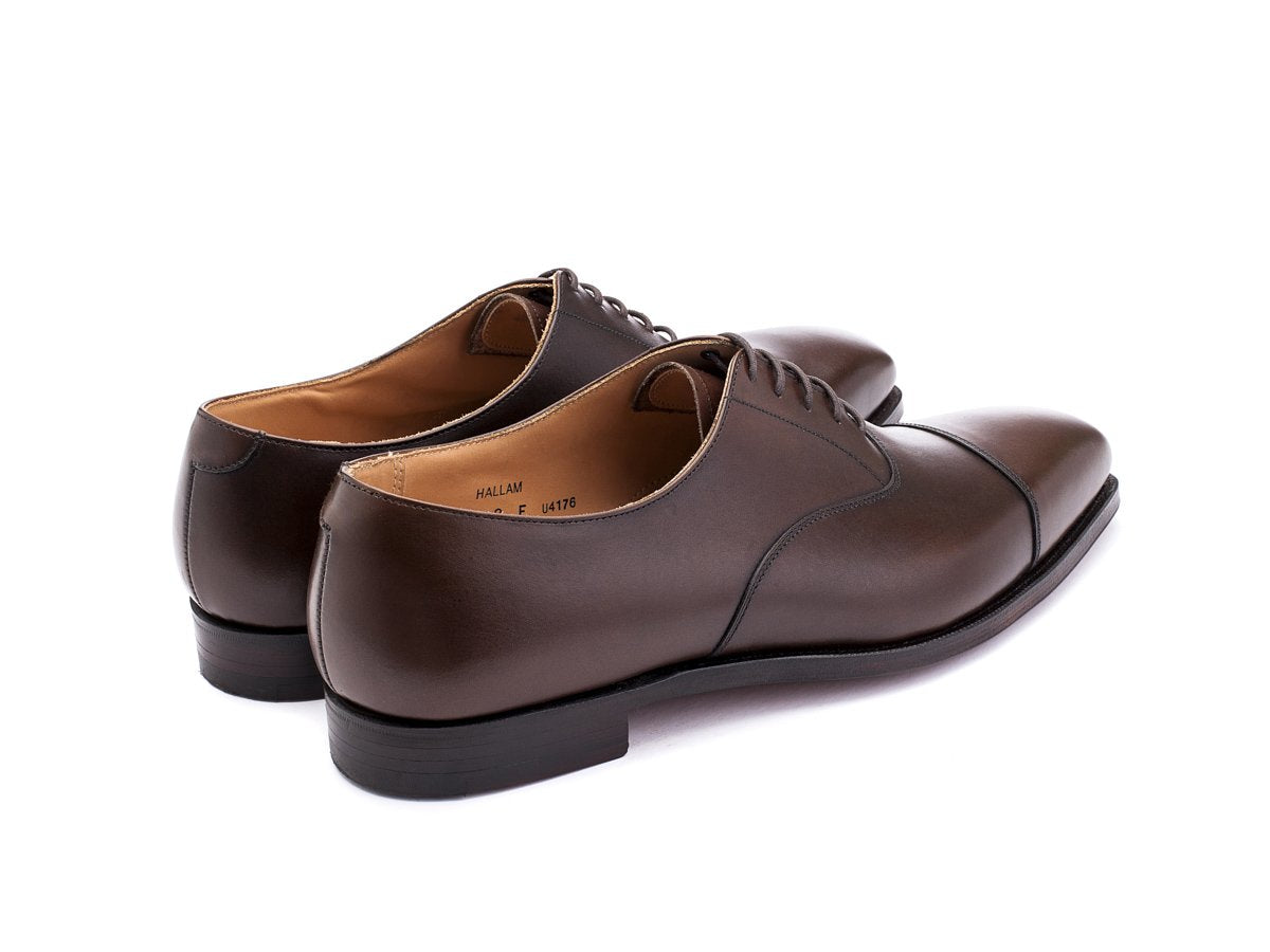 Back angle view of Crockett & Jones Hallam plain captoe oxford shoes in dark brown burnished calf