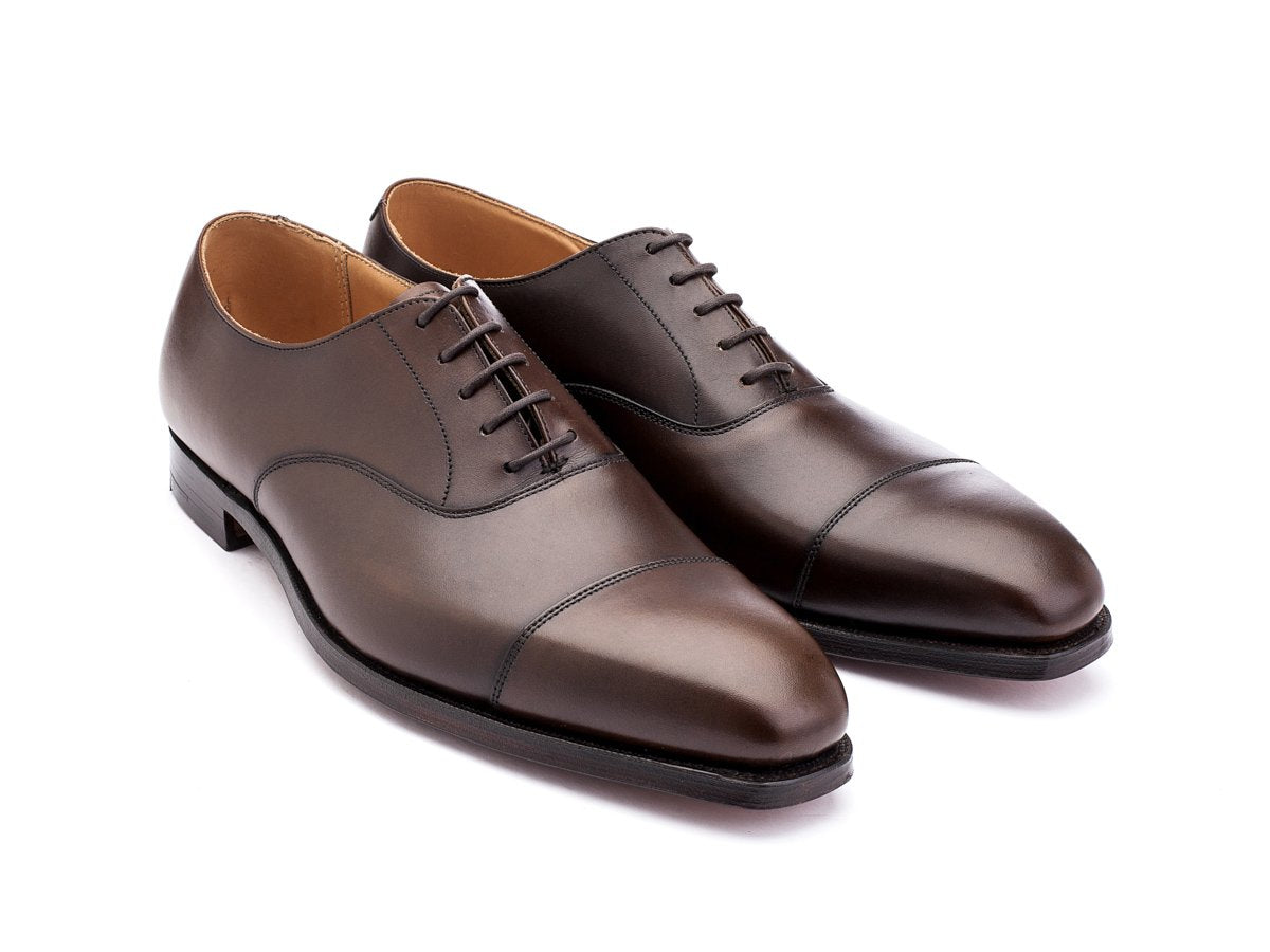 Front angle view of Crockett & Jones Hallam plain captoe oxford shoes in dark brown burnished calf