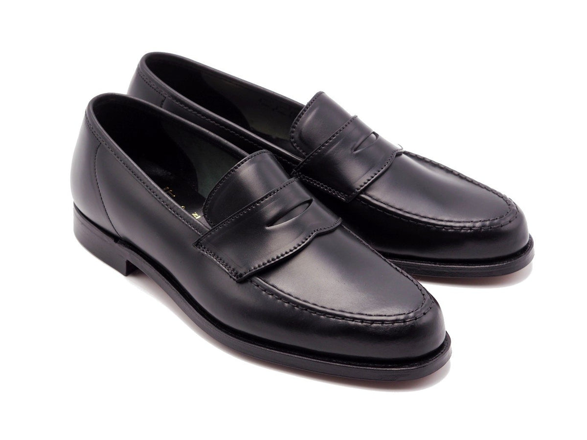 Front angle view of Crockett & Jones Harvard 2 penny loafers in black shell cordovan