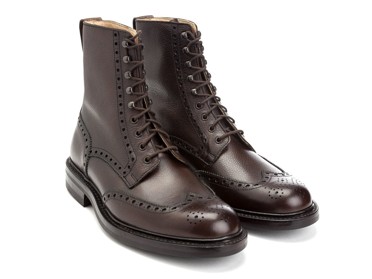 Front angle view of Crockett & Jones Islay wingtip brogue derby boots in dark brown scotch grain calf