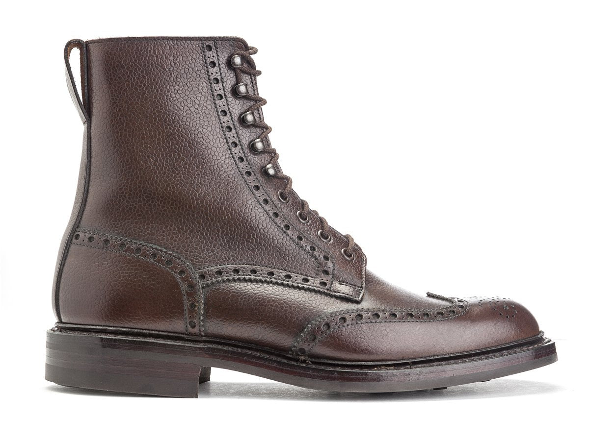 Side view of Crockett & Jones Islay wingtip brogue derby boots in dark brown scotch grain calf