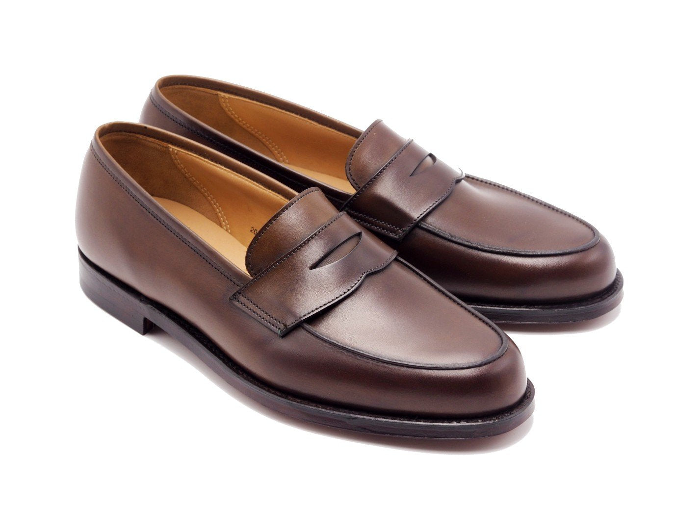 Front angle view of Crockett & Jones Kirribilli penny loafers in dark brown burnished calf