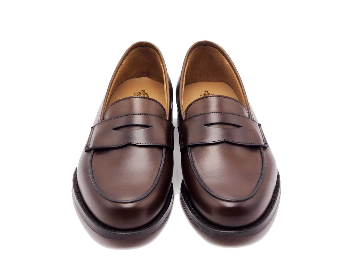 Front view of Crockett & Jones Kirribilli penny loafers in dark brown burnished calf