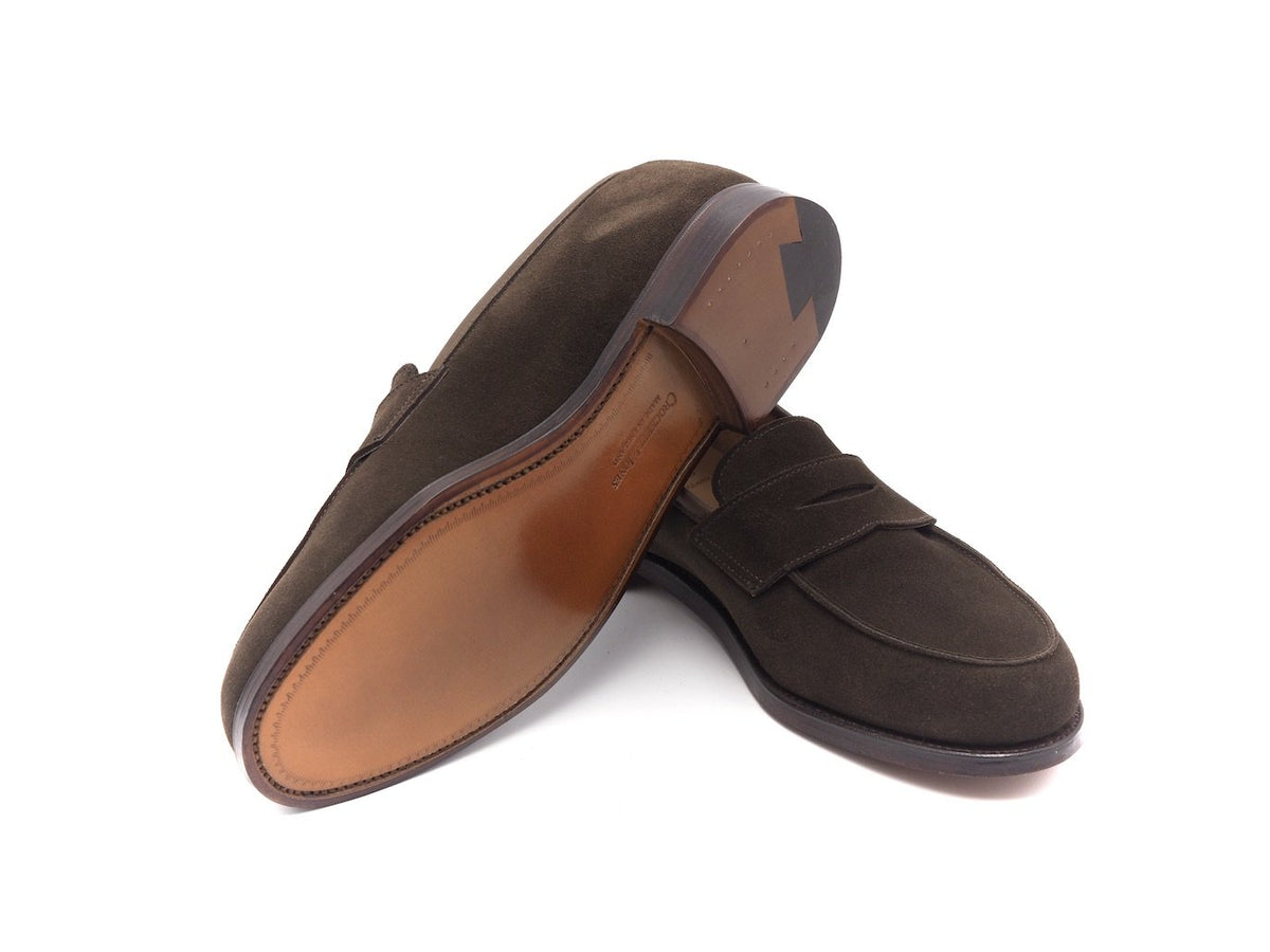 Leather sole of Crockett & Jones Kirribilli penny loafers in dark brown suede
