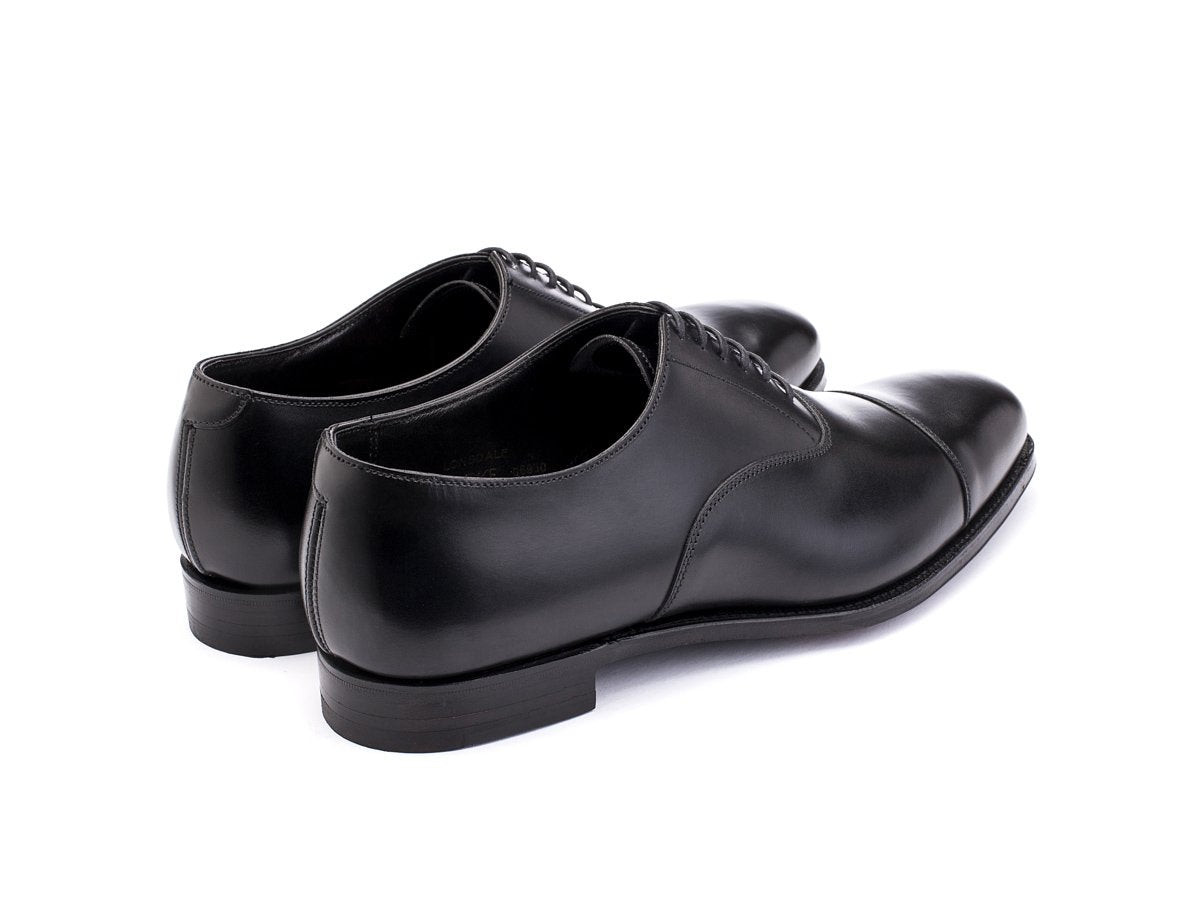 Back angle view of Crockett & Jones Lonsdale plain captoe oxford shoes in black calf